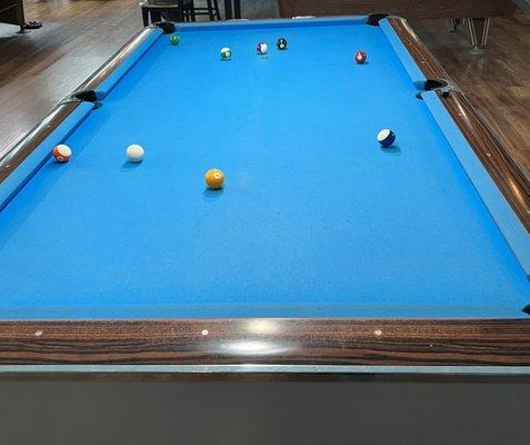 Normal sized pool table. They also have higher end ones and a smaller one you'd find in a bar.