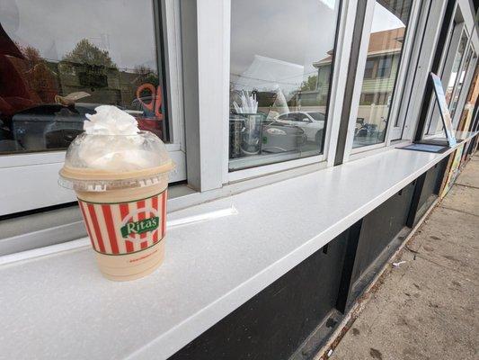 Frozen coffee and storefront