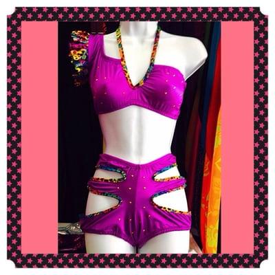 Sexy Colorful two piece club wear outfit. Ruffled sleeve, wrap around straps on bottom & studs throughout design.