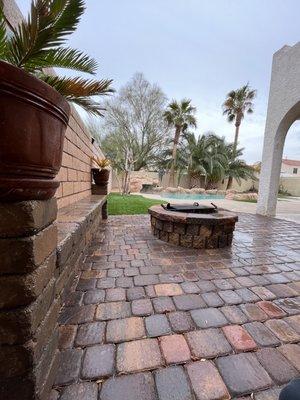 Fire pit and sitting area on pavers and artificial grass