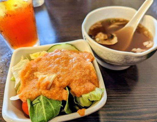 Salad with peanut dressing and mushroom soup.