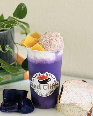 Amethyst Ube Taro Bubble Tea with an add on egg pudding and fresh taro toppings for a burst of flavor and extraordinary texture