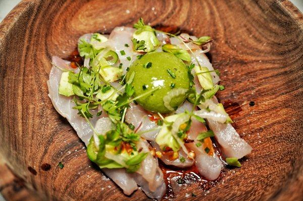 Rock fish crudo avocado jalapeño Agua chili sphere