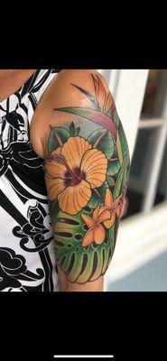 Hibiscus floral, half sleeve done by Tommy Tingle