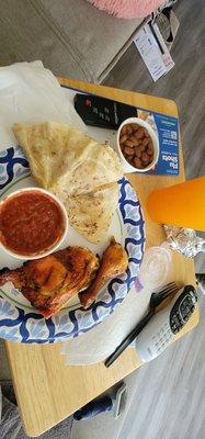 Chicken, beans, salsa and orange drink.