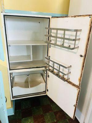 The original refrigerator that was given to the owners when they moved in.