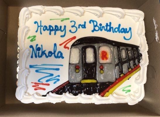 Ice cream cake. Great job with MTA train artwork on the cake.