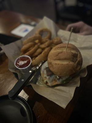 The grilled cluck.... I tried a bite and it was juicy and flavorful. Those battered onion rings were so good.