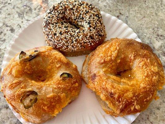 Fresh sourdough bagels.  Jalapeño cheddar, everything, and cheddar.  Yummy.