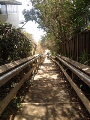 Stairs going down to the beach. Nice view and good workout for your legs!