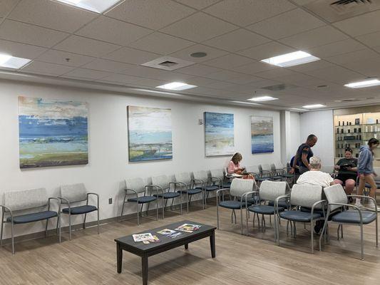 Waiting room with attractive art and product shelf.