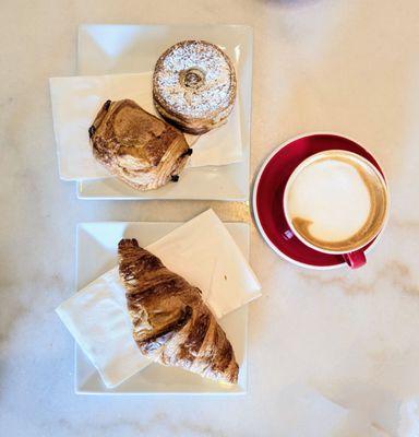 Cappuccino, plain croissant, chocolate croissant, and cronut