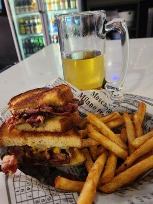 Pastrami sandwich with fries and 28-degree beer