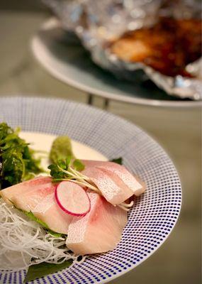 Yellowtail sashimi and Chilean Sea Bass (background)