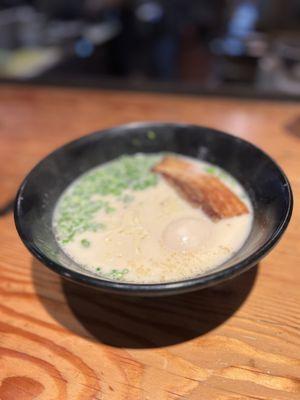 Tonkotsu shoyu ramen. Boring topping of just green onions and a slab of cha shu and egg.