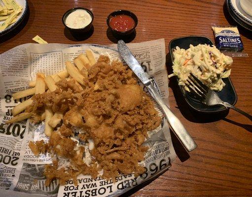 Cole slaw Is on the menu with fish and chips.