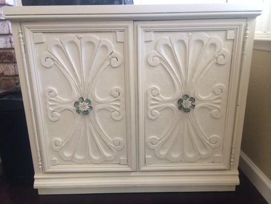 This is how my cabinet looks now! A little chalk paint goes a long way. Knobs purchased from Hobby Lobby.