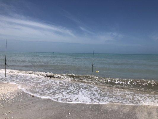 Fishing poles and beach