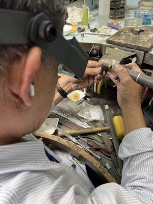 Polishing a ring to be brand new.