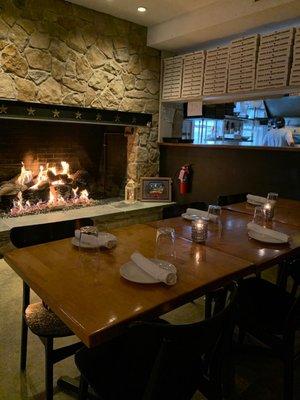 Interior: Fireplace and kitchen on a winter evening