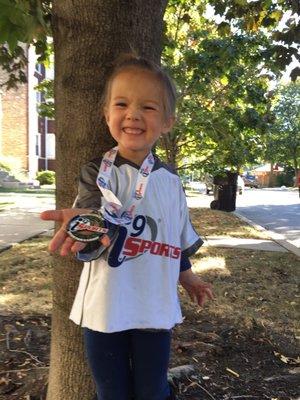 Proud of her medal; recognized for enthusiasm