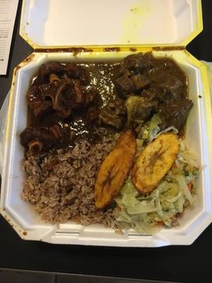 Oxtail and curry goal with rice and peas, cabbage and plantains.