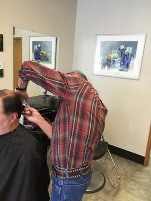 Hubby getting his hair cut.