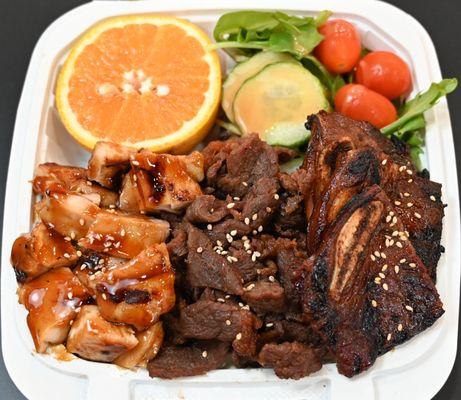 Bento Box E. -  Short Rib, Chicken, Ribeye Steak! Comes with rice, salad & Fruit. - Substitute Dumplings for fruit or salad.