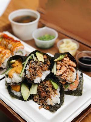 Uni hand roll, truffle salmon skin hand roll, baked salmon hand roll, salmon belly hand roll, and lion king roll in the back!