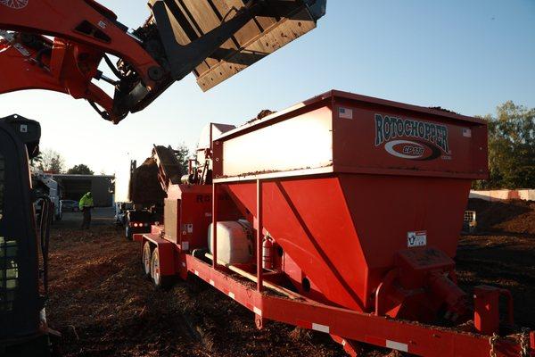 We pride ourselves on striving to be a zero waste tree company.  Here a load of raw chips has just been fed into our wood chip conditioner.