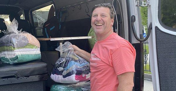 Laundry Wand Laundromat owner David Standing by delivery van whilst out doing Laundry Pickup and Delivery