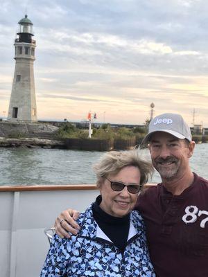 Brian with mom in front of Buffalo lighthouse