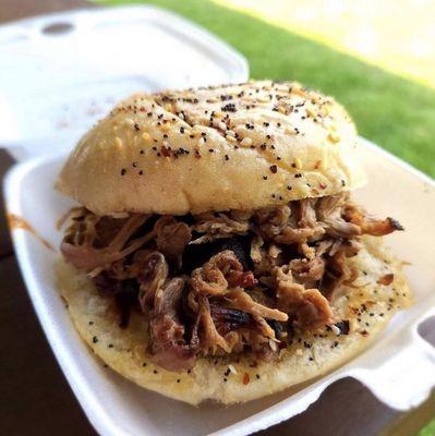 Pulled pork sandwich on an everything bun