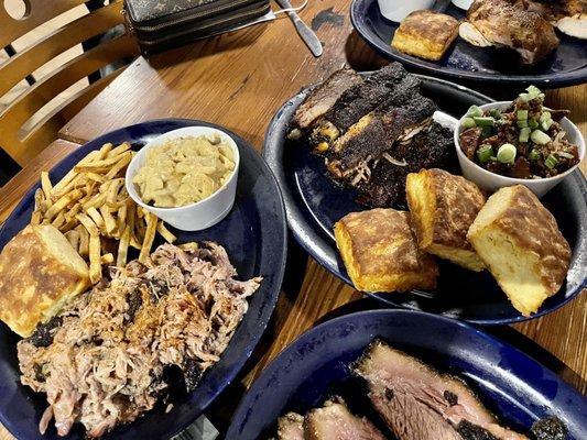 (L to R) Pulled Pork, Sliced Brisket, St. Louis-Style Ribs, Smoked 1/2 Chicken.