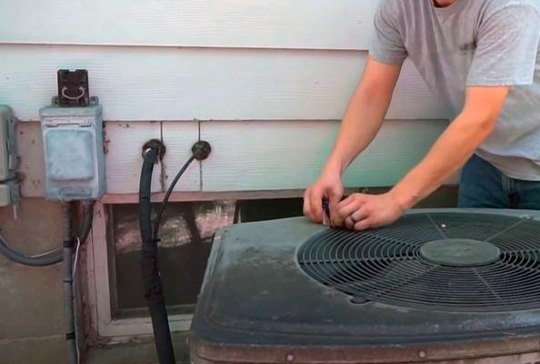 Patrick from AC Repair Team repairing my air conditioning unit.