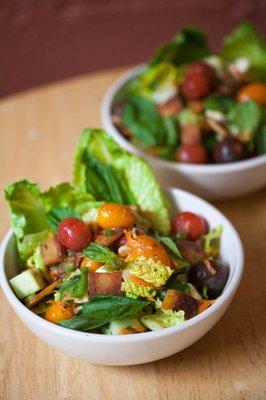 Fatoush ($6)  Lettuce, cucumbers, peppers, tomatoes, mozzarella and fried pita croutons dressed with lemon/olive oil vinaigrette