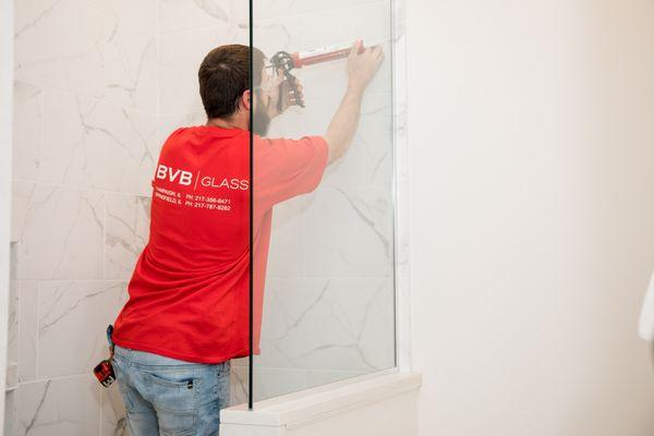 Installation of new shower glass and door.