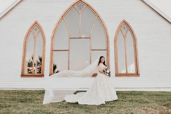 Bride at sunset with flowing veil at the brooks wedding venue by April pinto photography