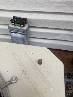 Fuse left removed and small round Freon cap left on top of A/C unit