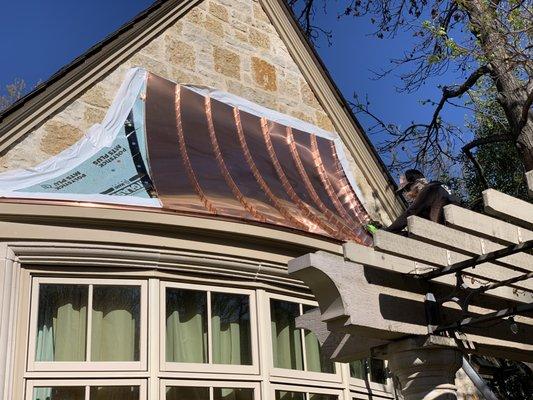 Custom Copper Awning work all provided by Priority Roofing