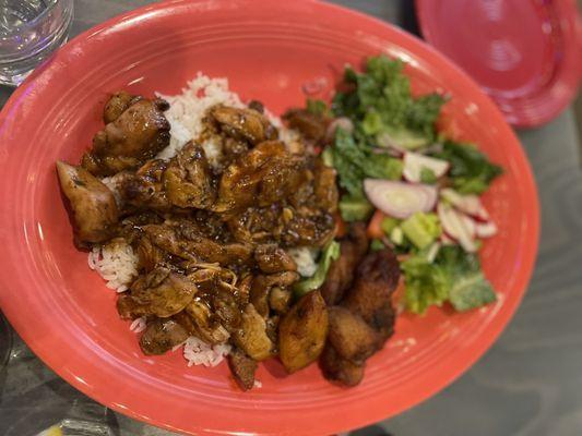 Jerk chicken with plantains, rice and salad. Very flavorful.