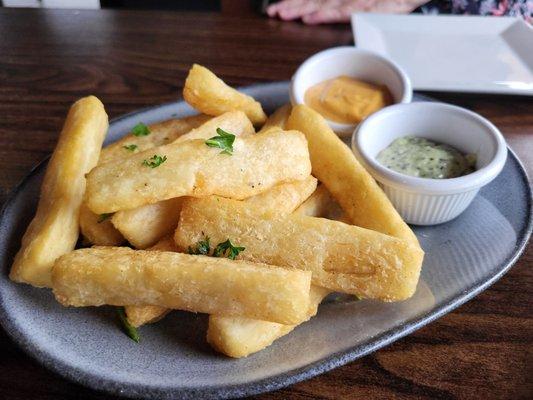 Yuca fries appetizer. The dipping sauces are a must try!