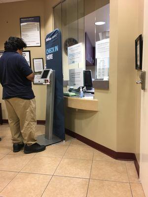 Check in to this machine, don't ask for help, nobody comes to this window.