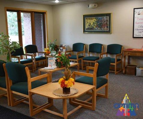 Relax and recharge. Another cozy corner of our waiting room, where your wellness journey begins in comfort and care.