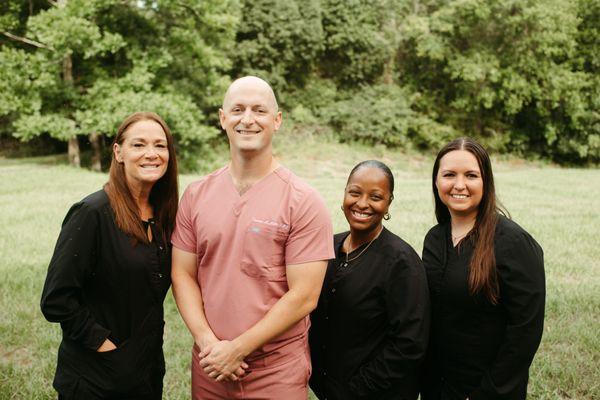 Our owner and dentist, Dr. Cameron McMillin with our dental assistants.