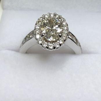 Oval Shaped Lab Grown diamond in a halo setting.