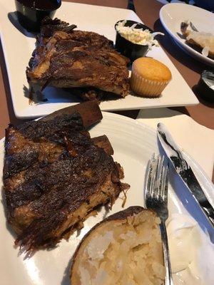 Ribs, baked potato, cole slaw and corn bread