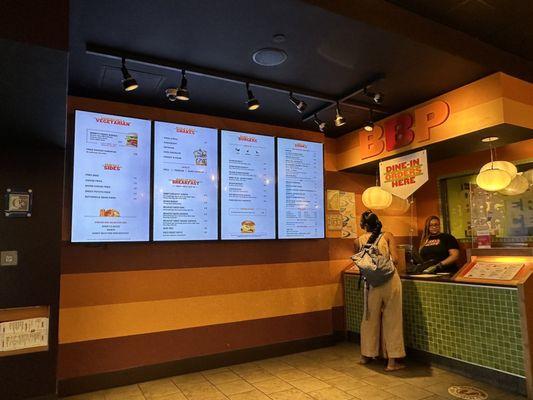 Menu options and order desk. To go order kiosk available at second entrance.