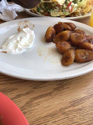 Plantains served with sour cream