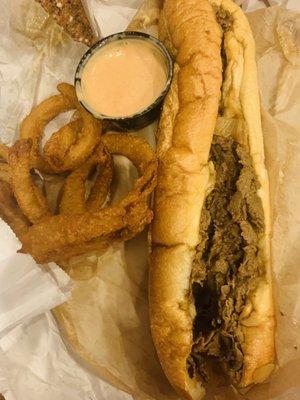 Philly cheesesteak and onion rings.